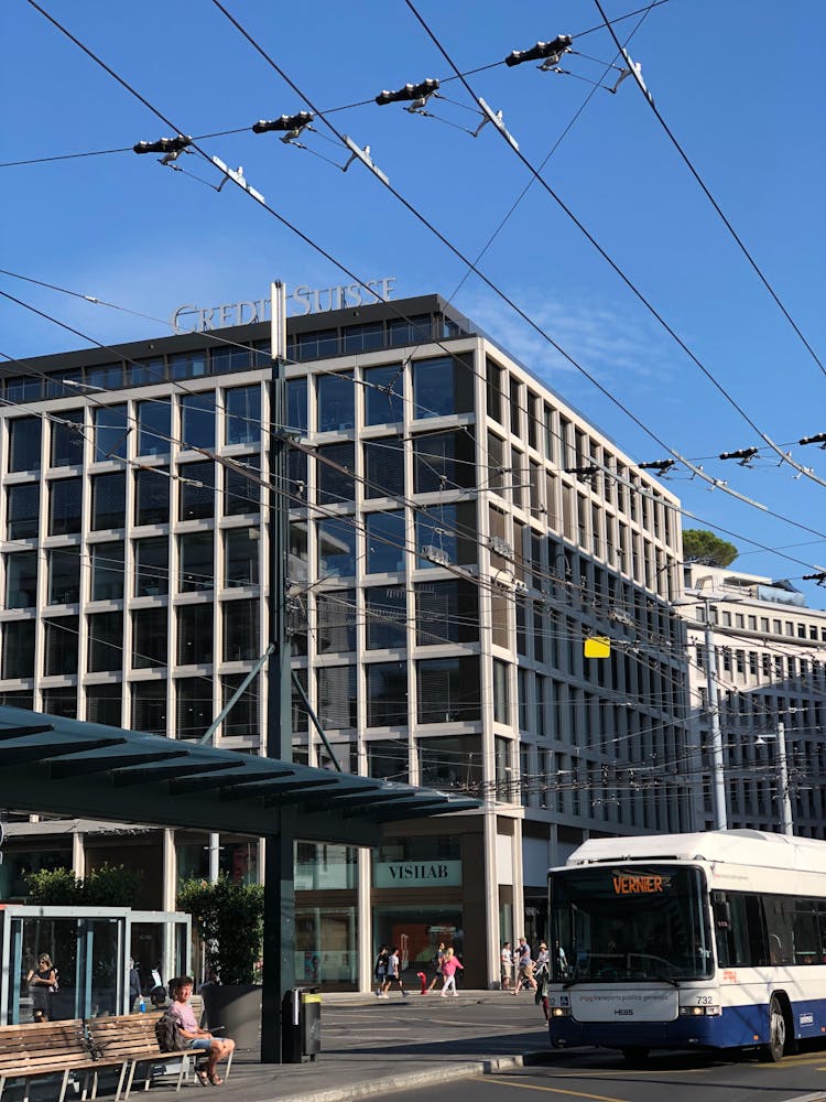 Bus And Bus Station In Front Of Modern Buildings