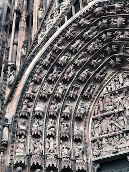Close-up of the detailed gothic tympanum at Strasbourg Cathedral, France.