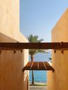 Brown Wooden Pergola between Stone Buildings