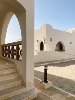 Elegant architecture featuring Mediterranean design elements with arches and geometric shapes.