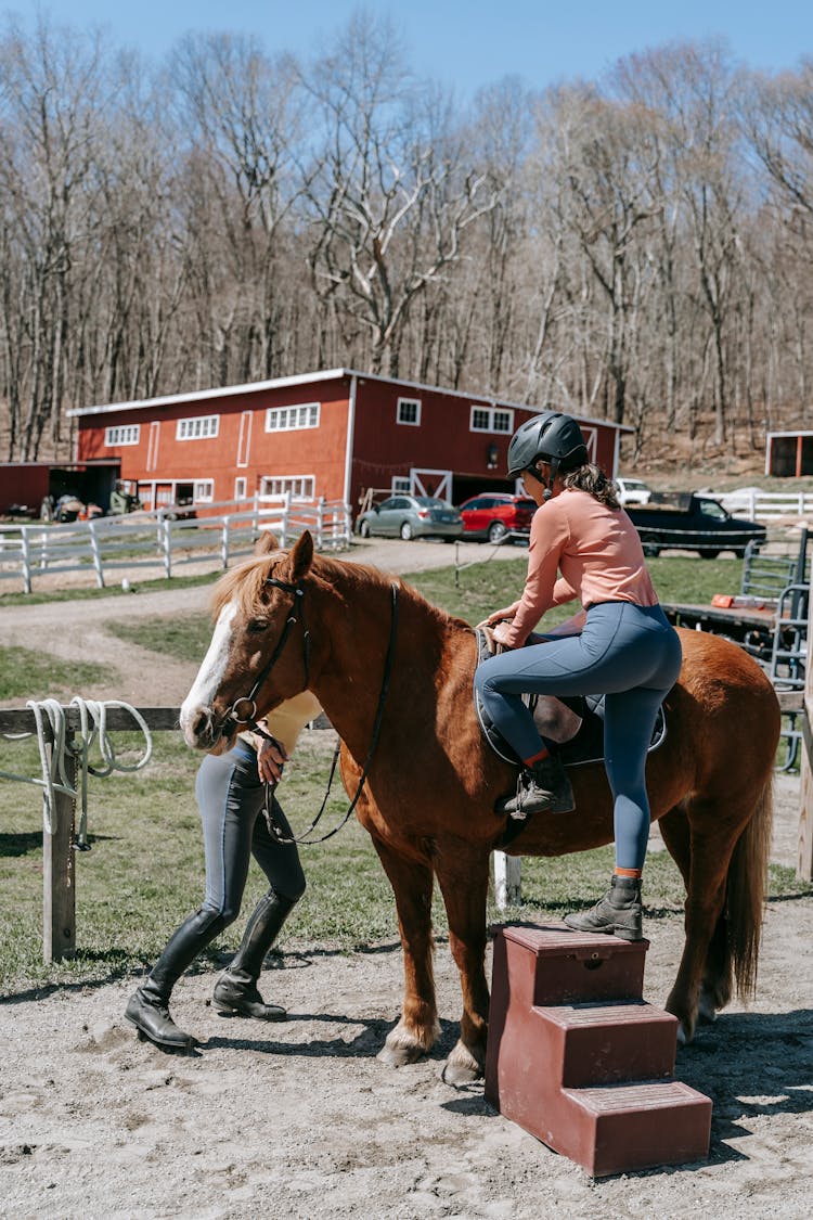 Women Climbing Horse