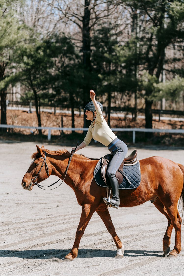 A Woman Riding A Horse