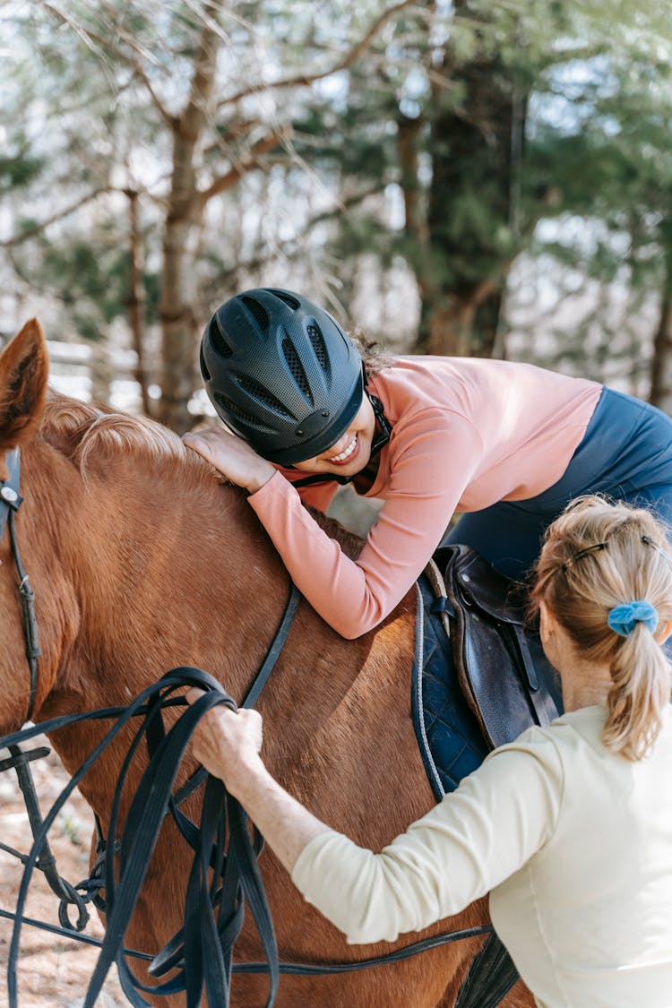 Woman Riding A Brown Horse