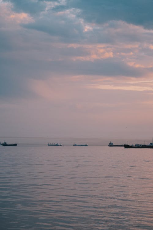 Fishing Boats on the Sea during Sunset