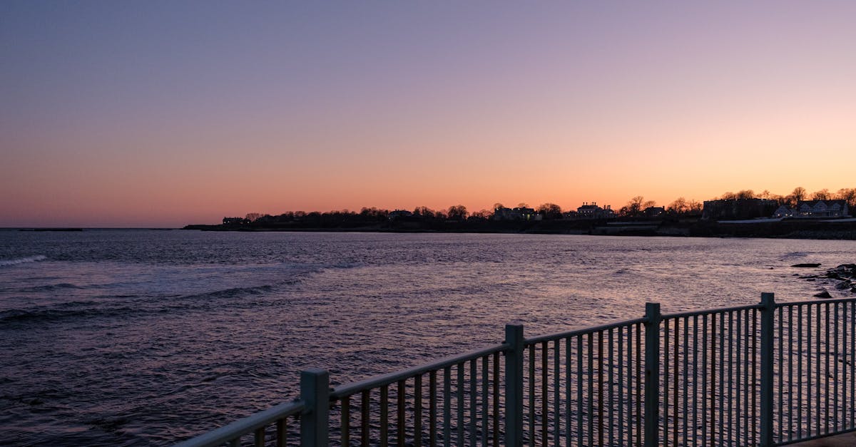 Viewing Platform with Metal Railings Under Sunset Sky · Free Stock Photo