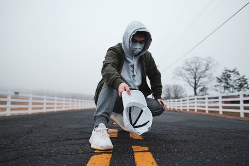 Stylish Man posing in the Middle of the Road 