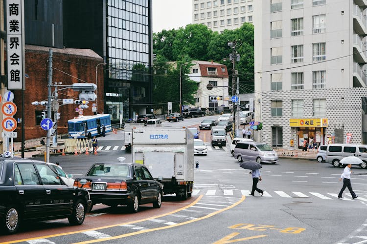 Cars Driving Road In Asian City