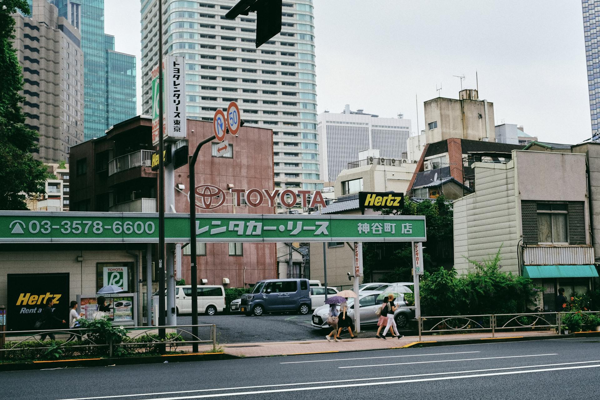 A Rent A Car Business Along An Asphalt Road