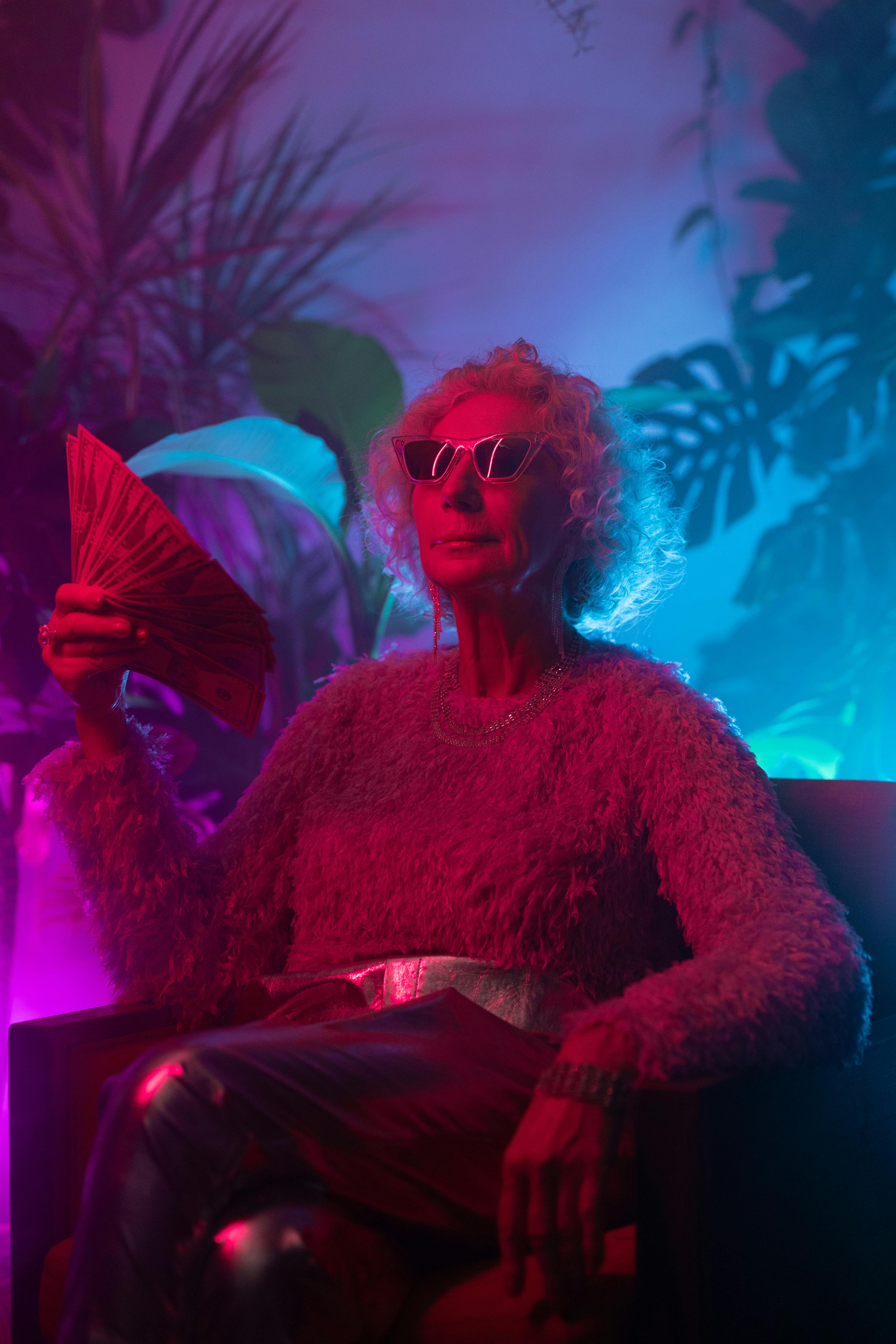 photo of stylish grandma holding huge amount of money