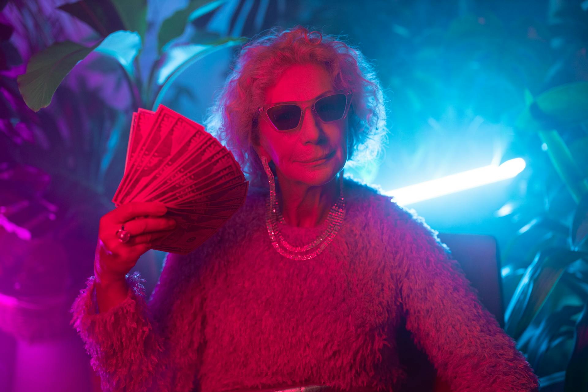 Photo of an Elderly Woman Flaunting Money