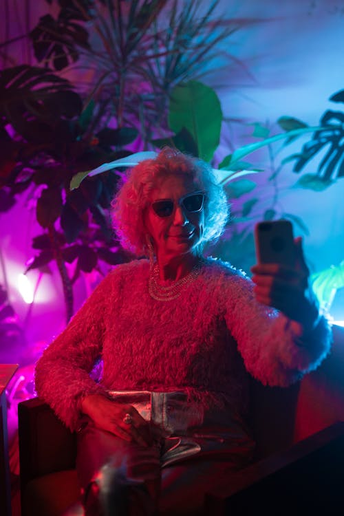 Photo of an Elderly Woman Taking a Selfie