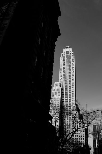 A stunning black and white cityscape featuring towering skyscrapers contrasting with the sky.