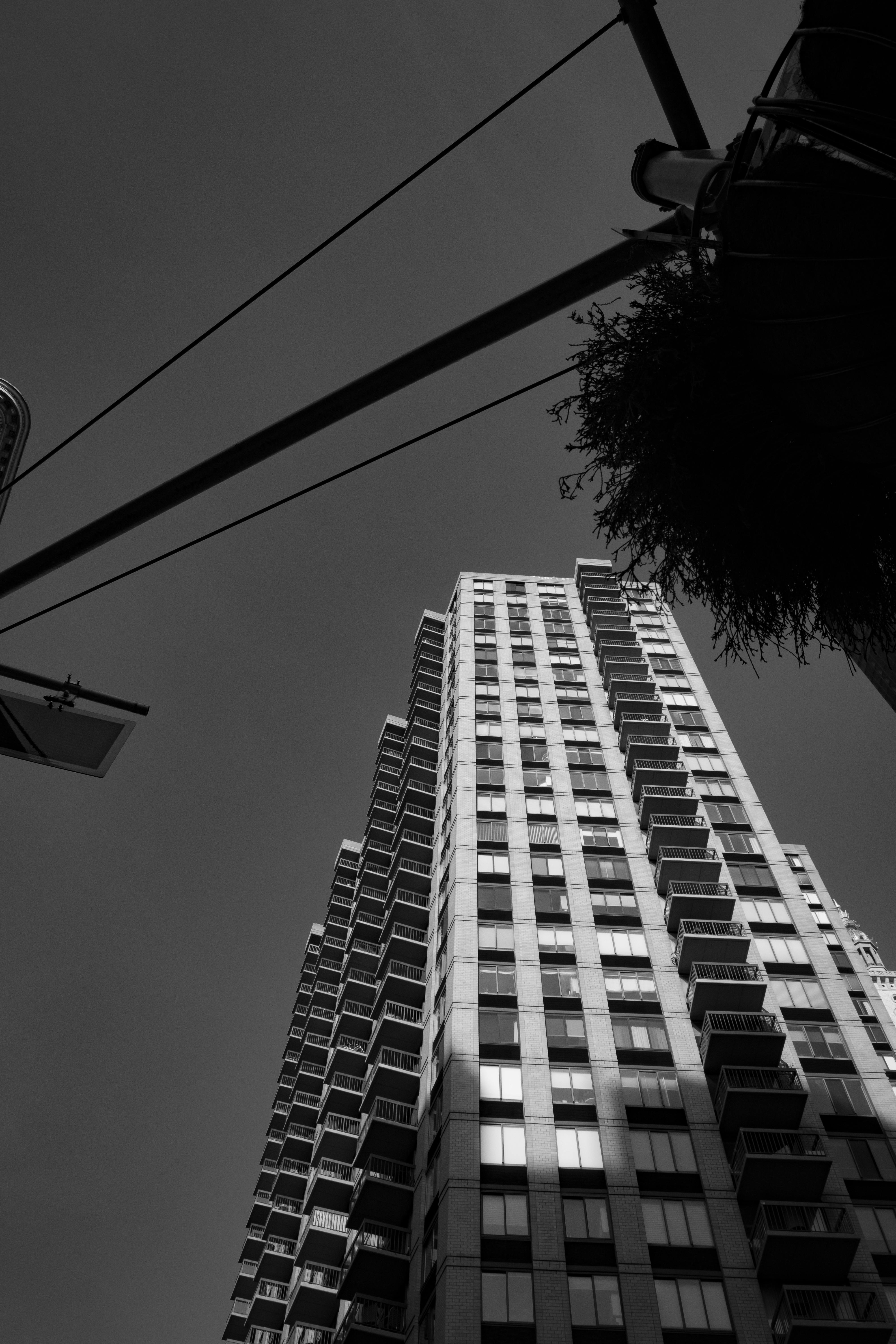 Monochrome image of a high-rise building from a low angle in New York City.
