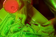 Close-Up Photo of Person Putting Glitters on Paper