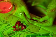 Close-Up Photo of Person Putting Glitters on Paper