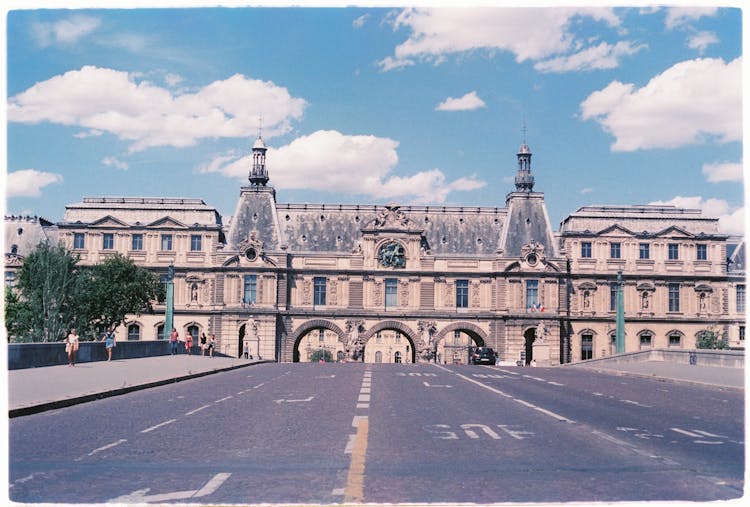 Pont Du Carrousel Under Blue Cloudy Sky 