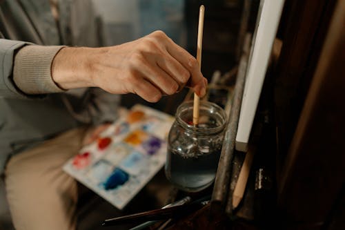 Free Person Dipping A Paintbrush On Water Stock Photo
