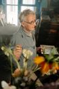 Senior Adult Painter holding a Palette