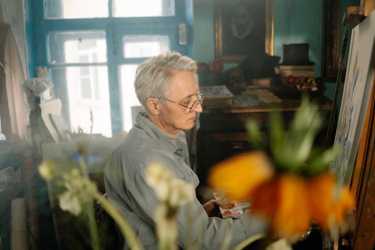 An Elderly Man Doing Painting