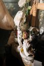 White Ceramic Figurine on Black Table
