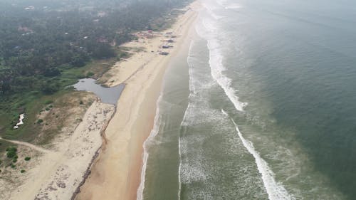 Free Aerial Photography of Sea Waves Crashing on the Sea Shore Stock Photo