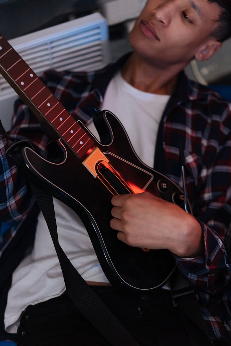 A Man Playing Guitar Video Game