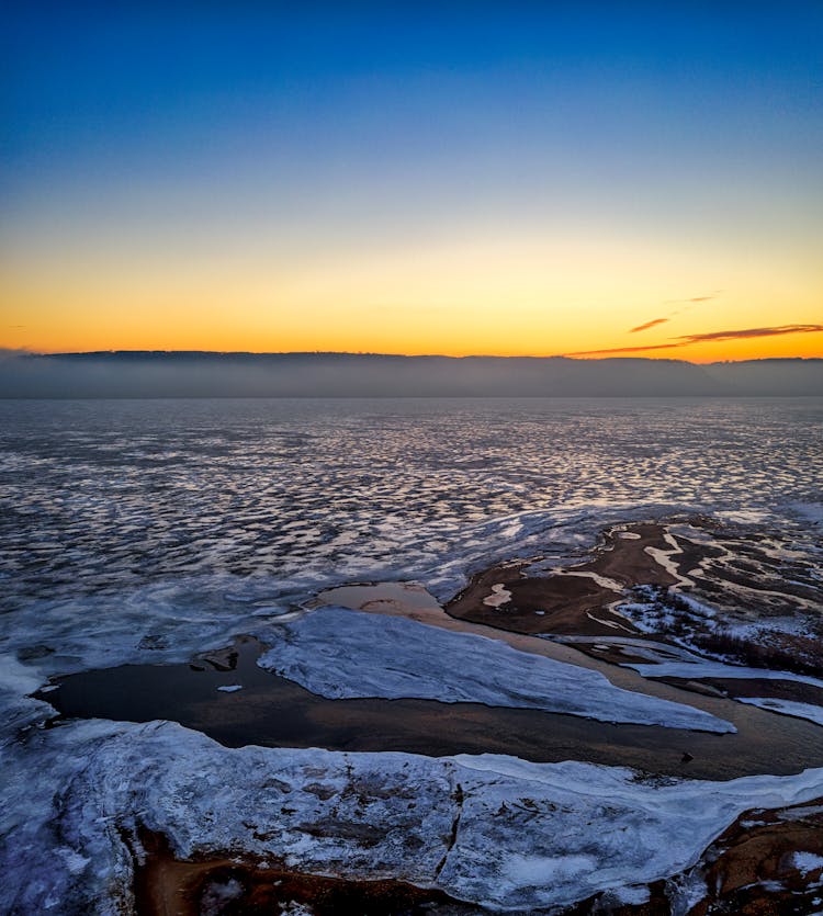 Frozen Lake During Sunrise