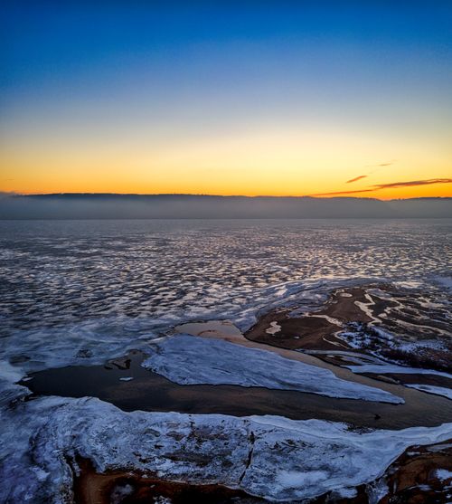 Free Stunning aerial capture of a frozen lake at dawn, showcasing winter's beauty in Minnesota. Stock Photo