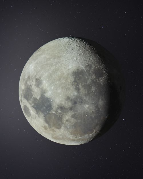 Free Close-up of the moon with starry night sky backdrop showcasing lunar craters. Stock Photo