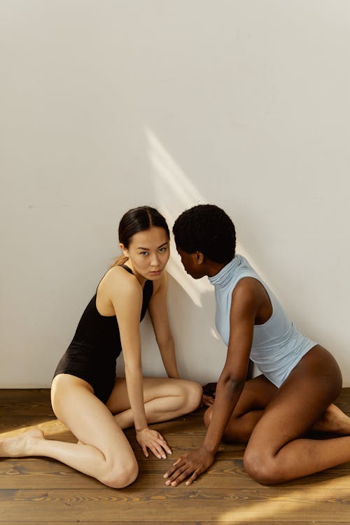 Free Two Women Sitting on a Floor Stock Photo