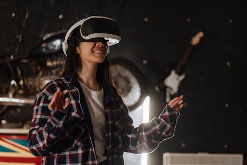 Free Happy Woman using Virtual Reality Goggles  Stock Photo