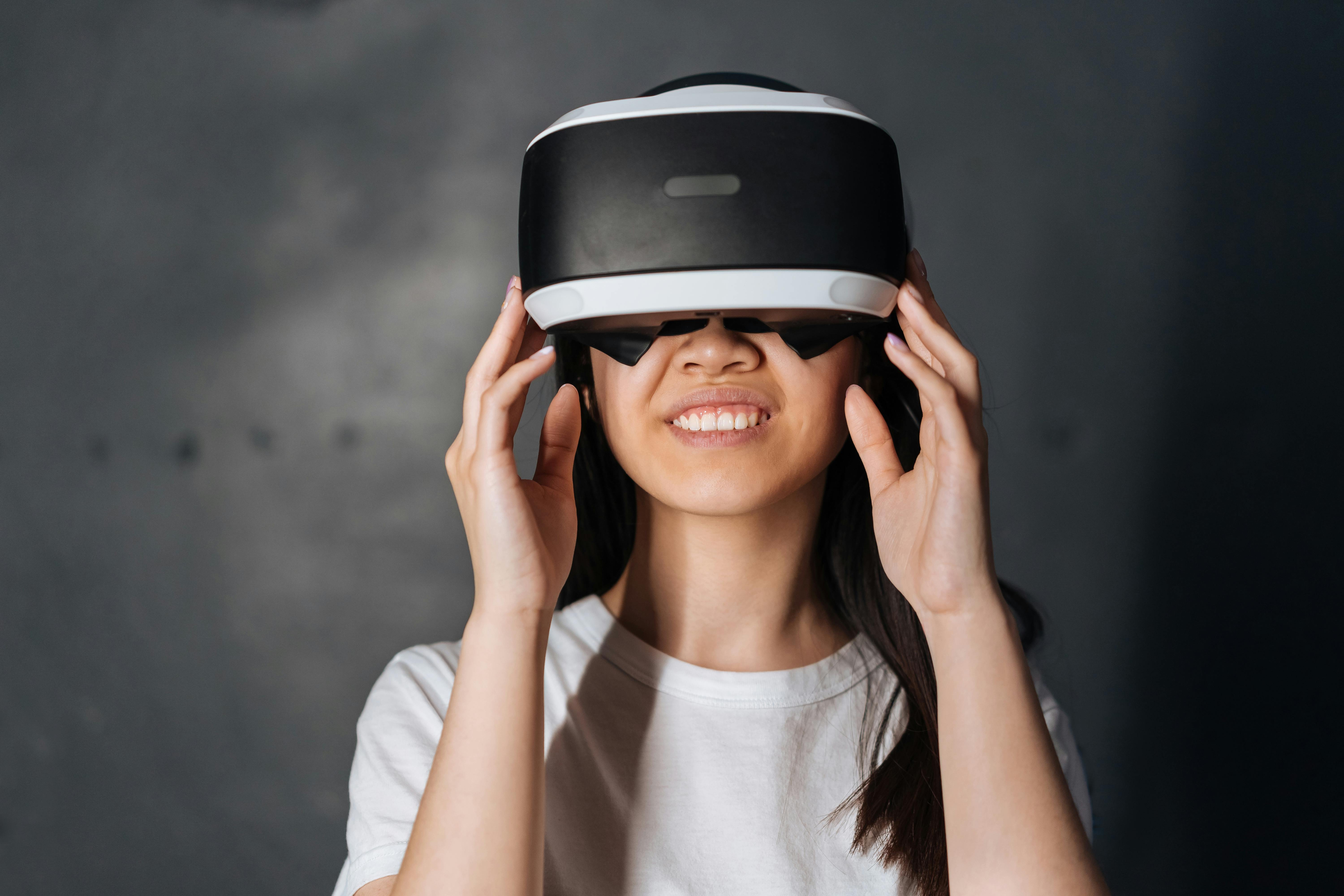 close up photo of young woman using virtual reality goggles
