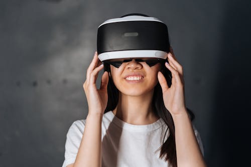 Close-up Photo of Young Woman using Virtual Reality Goggles 