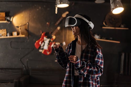 A Girl in Checkered Long Sleeves Using Virtual Reality Headset