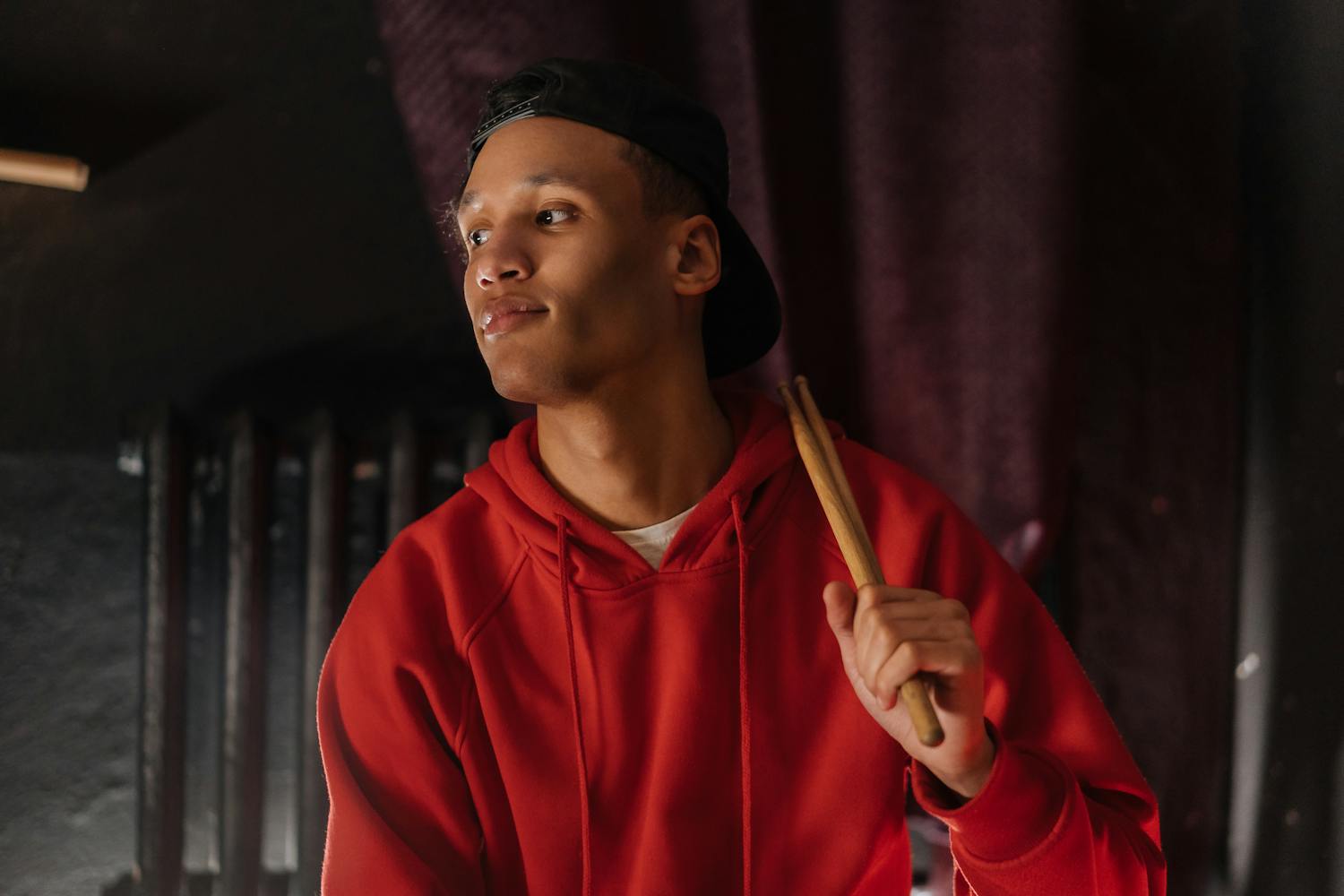 Young drummer with drumsticks