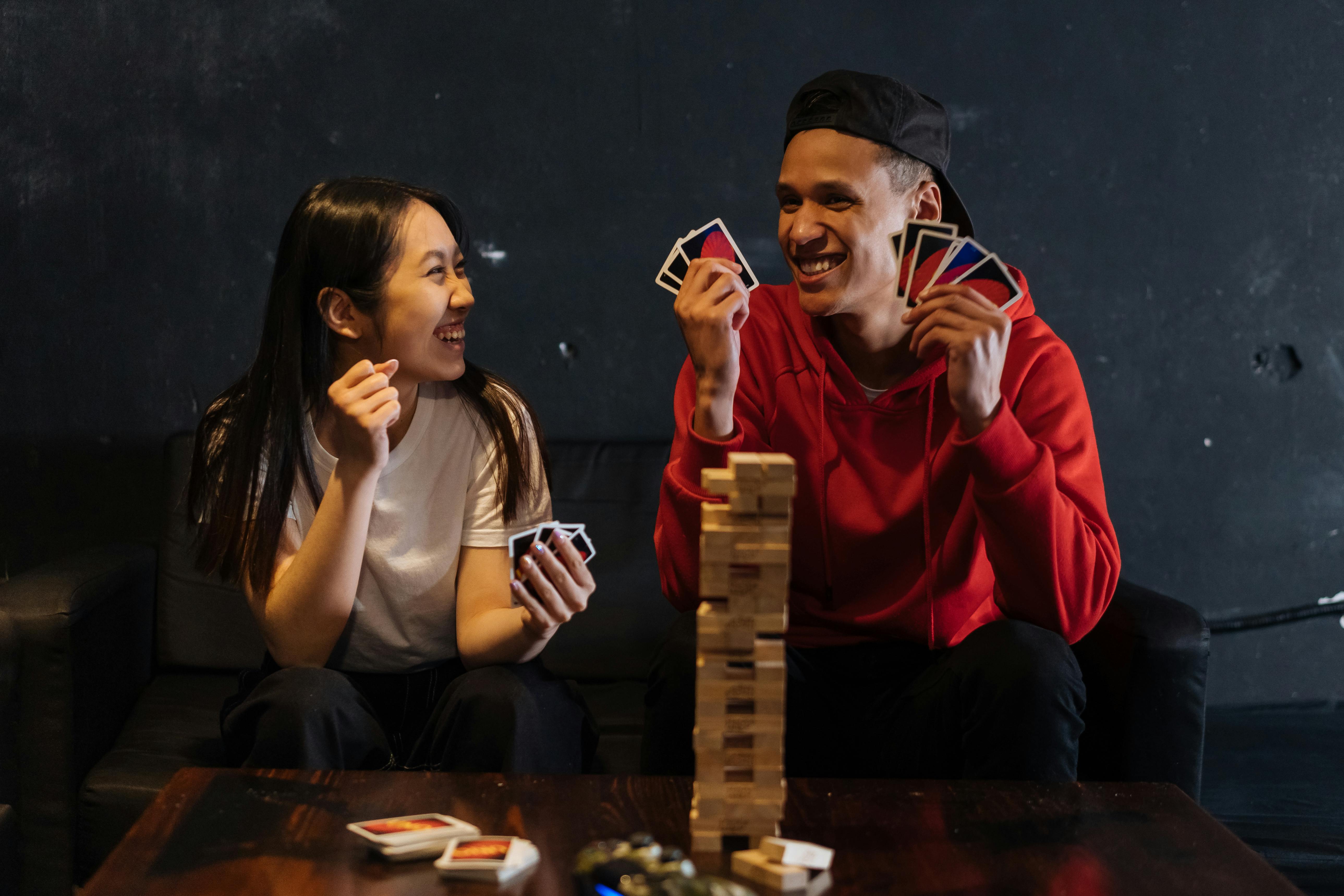 man and woman playing games together with smile