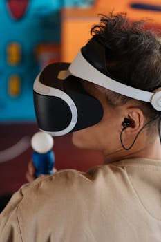 Man enjoying immersive gaming using VR headset and motion controller.