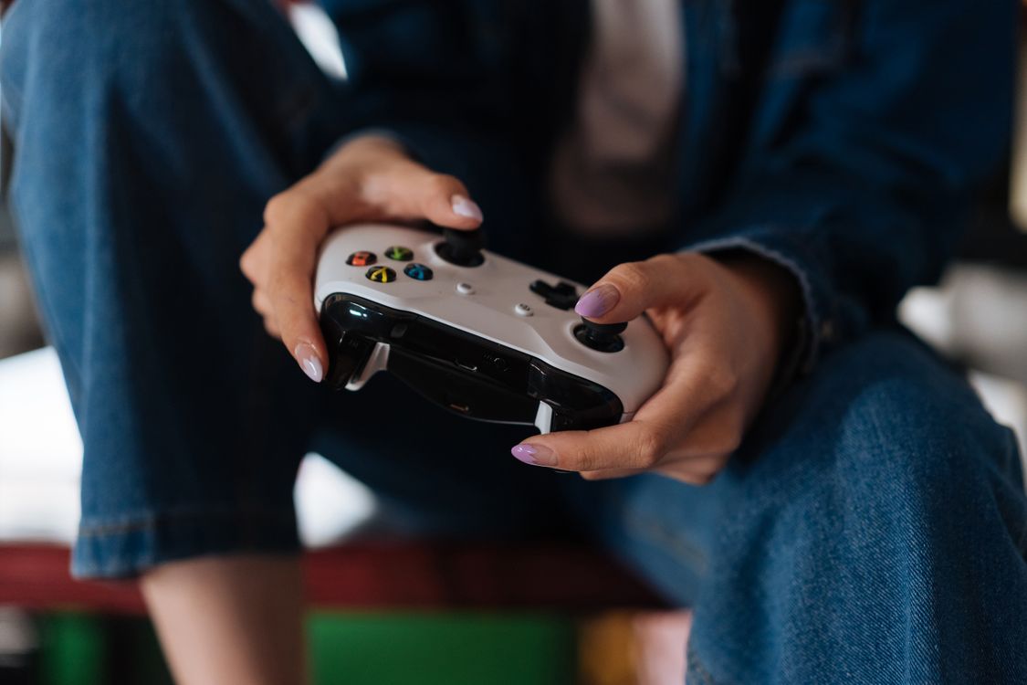 Person Using Game Controller Person Holding a Game Controller · Free Stock Photo