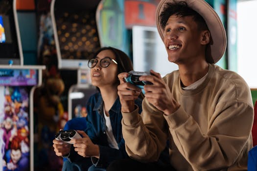 Two young adults having fun playing video games together in an arcade setting.
