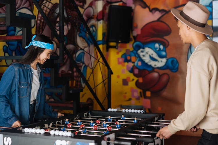 Friends Playing Foosball