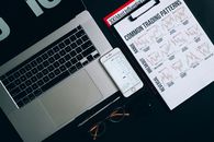 Smartphone, Laptop and Paper Printout on Flat Surface