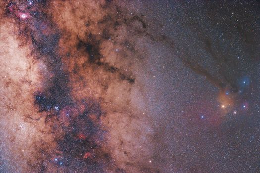 A mesmerizing capture of the Milky Way galaxy's core, showcasing vivid celestial colors and star clusters.