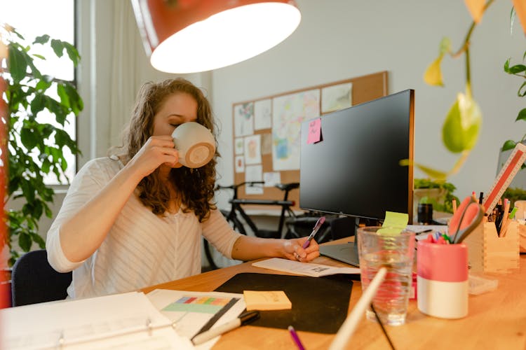 Woman Drinking On Ceramic Mug