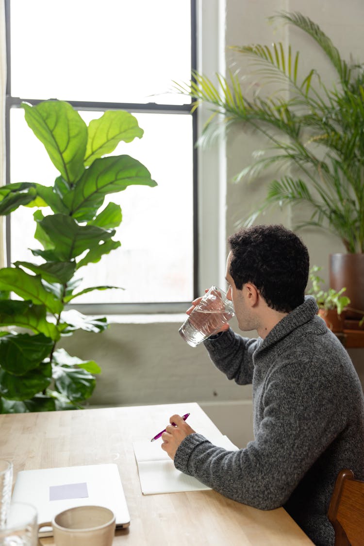 Man Drinking A Glass Of Water