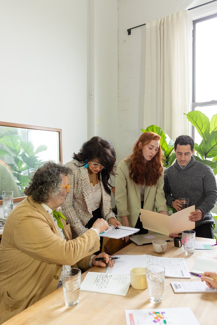 Colleagues Looking At Documents