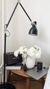 Workplace with table near lamp
