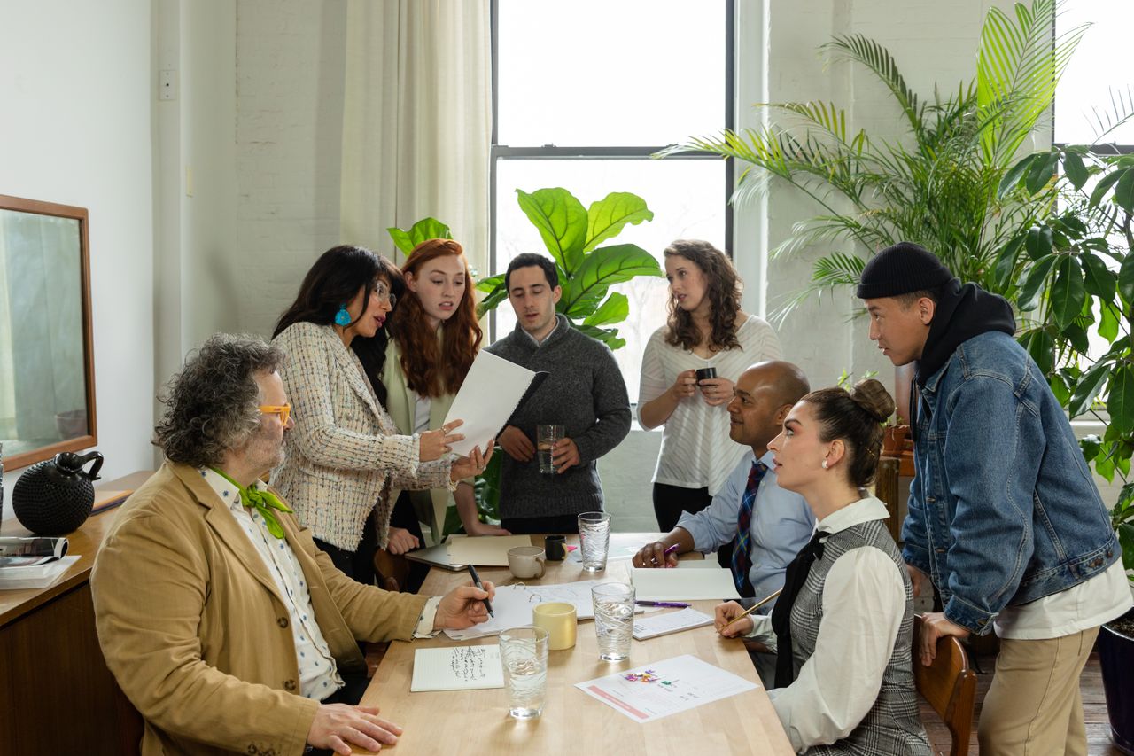 Multicultural professional team collaborating in a real modern office