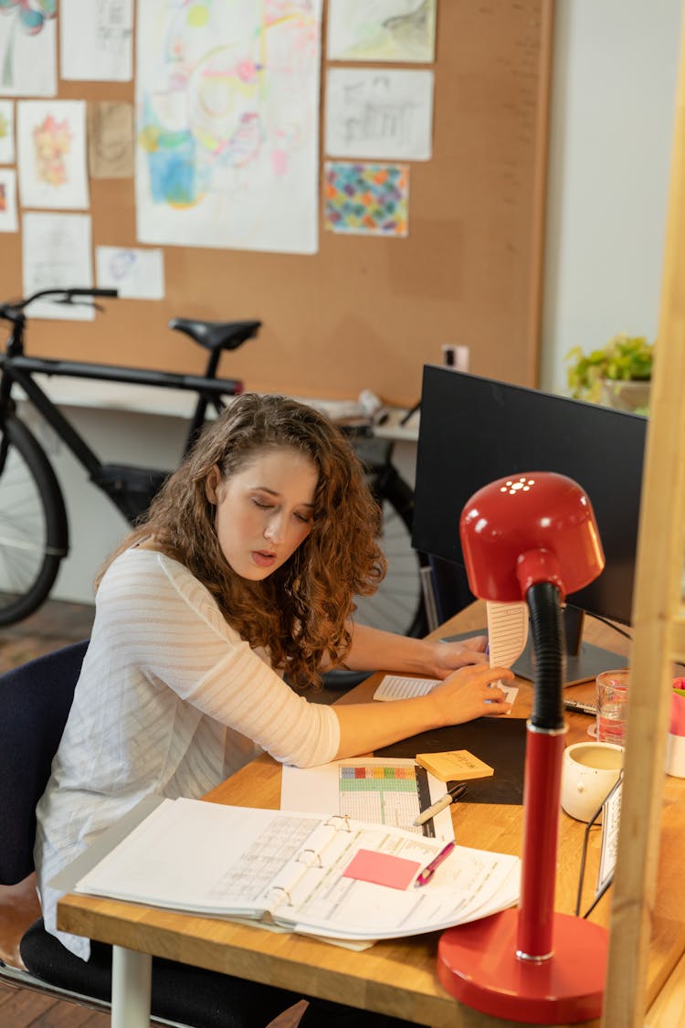 Woman Looking At Documents