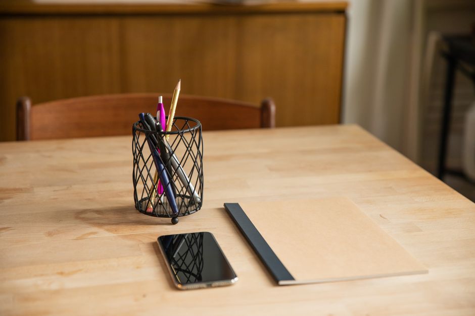 notebook and pen on desk everyday scene lifestyle photo 1