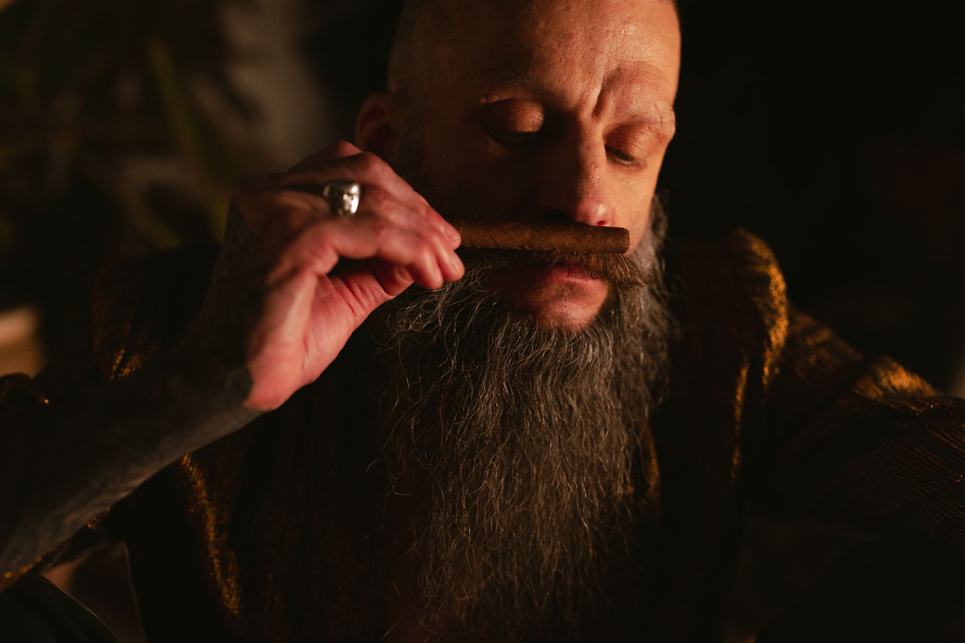 Close-Up Photo of Man Smelling Tabaco